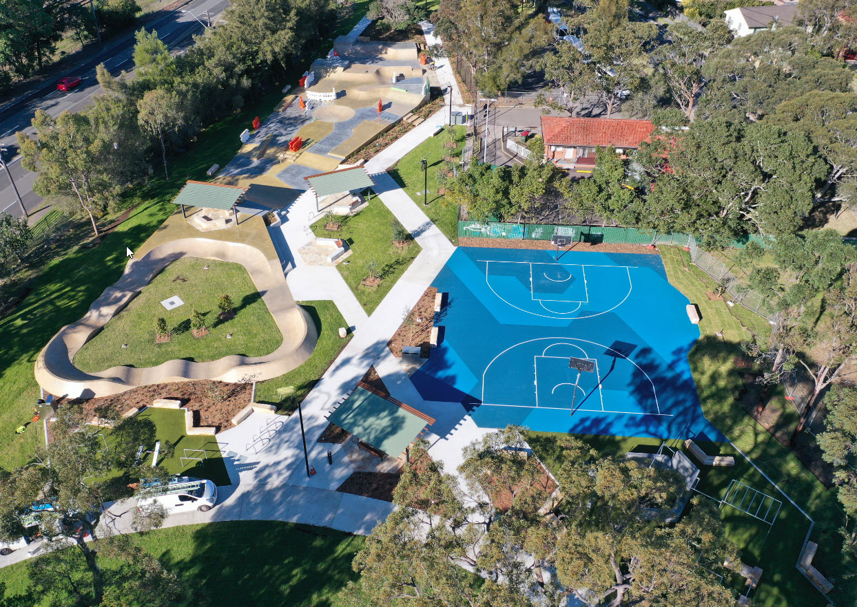 aerial view of pump track fitness equipment and basket ball court