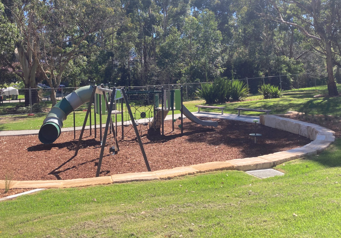 play equipment showing small tube slide