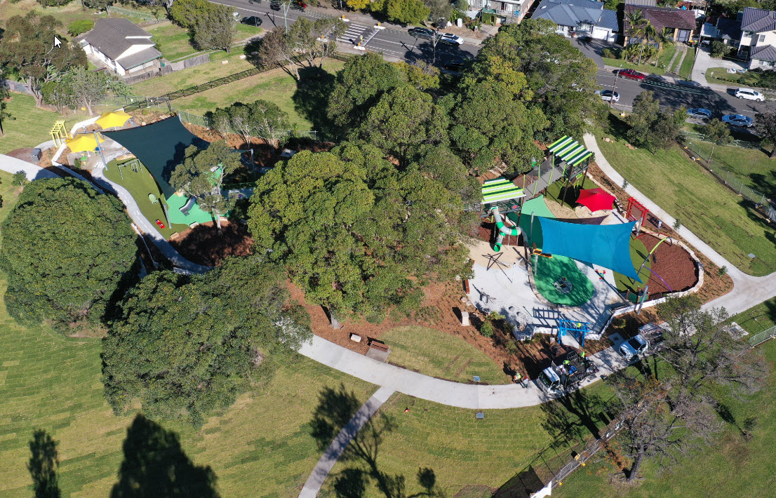 Overhead view of the playground layout with shade trees