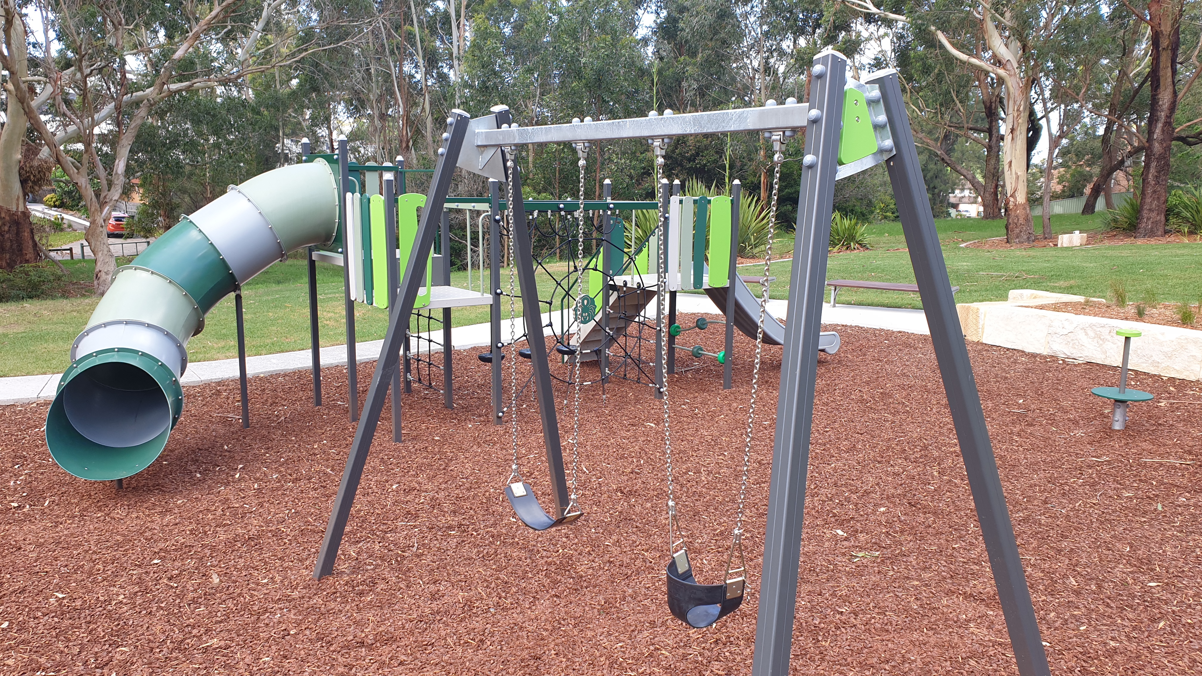 play equipment including tube slide and swings