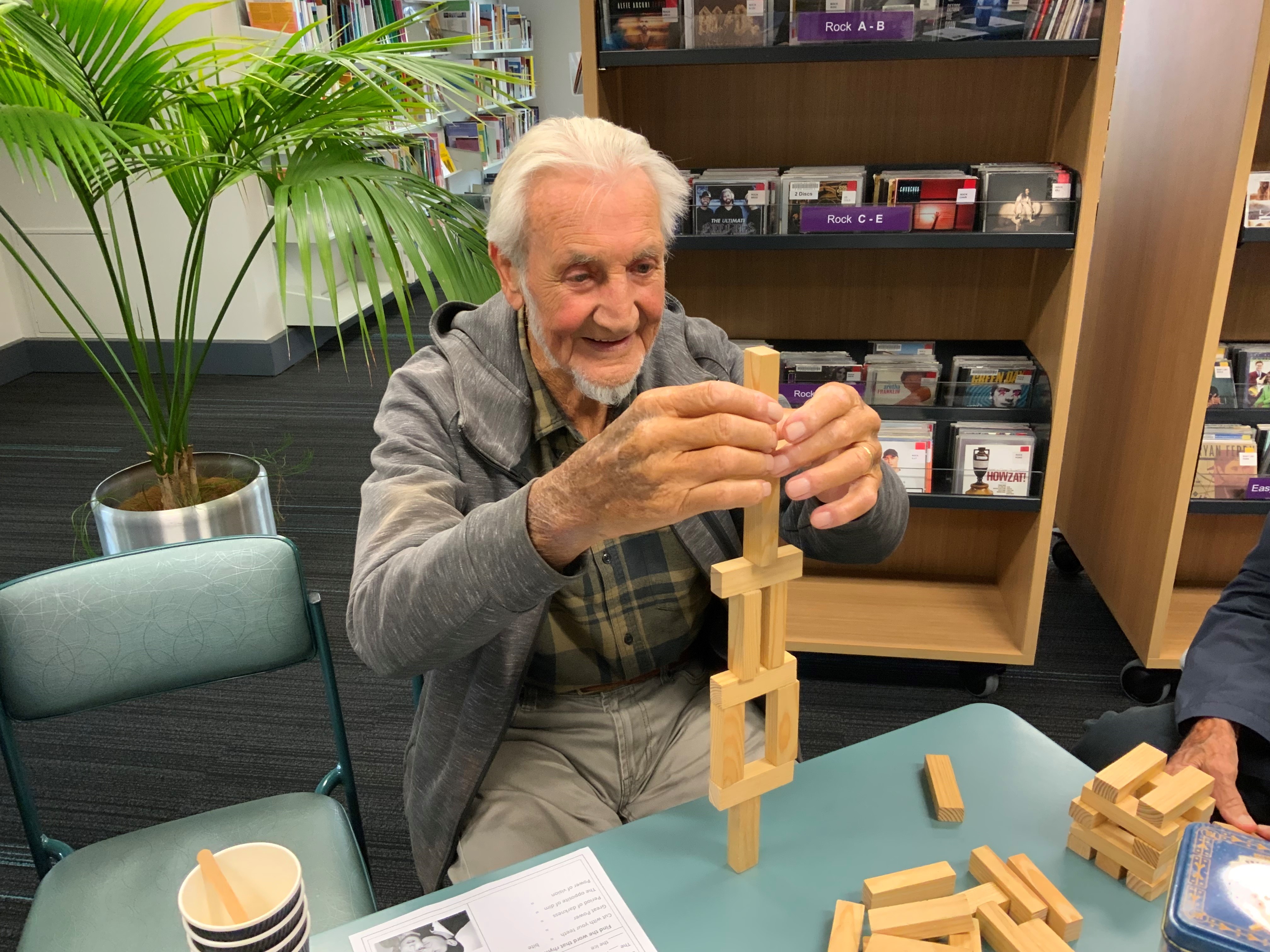 2023 Connection Cafe group dementia and carer session man playing jenga