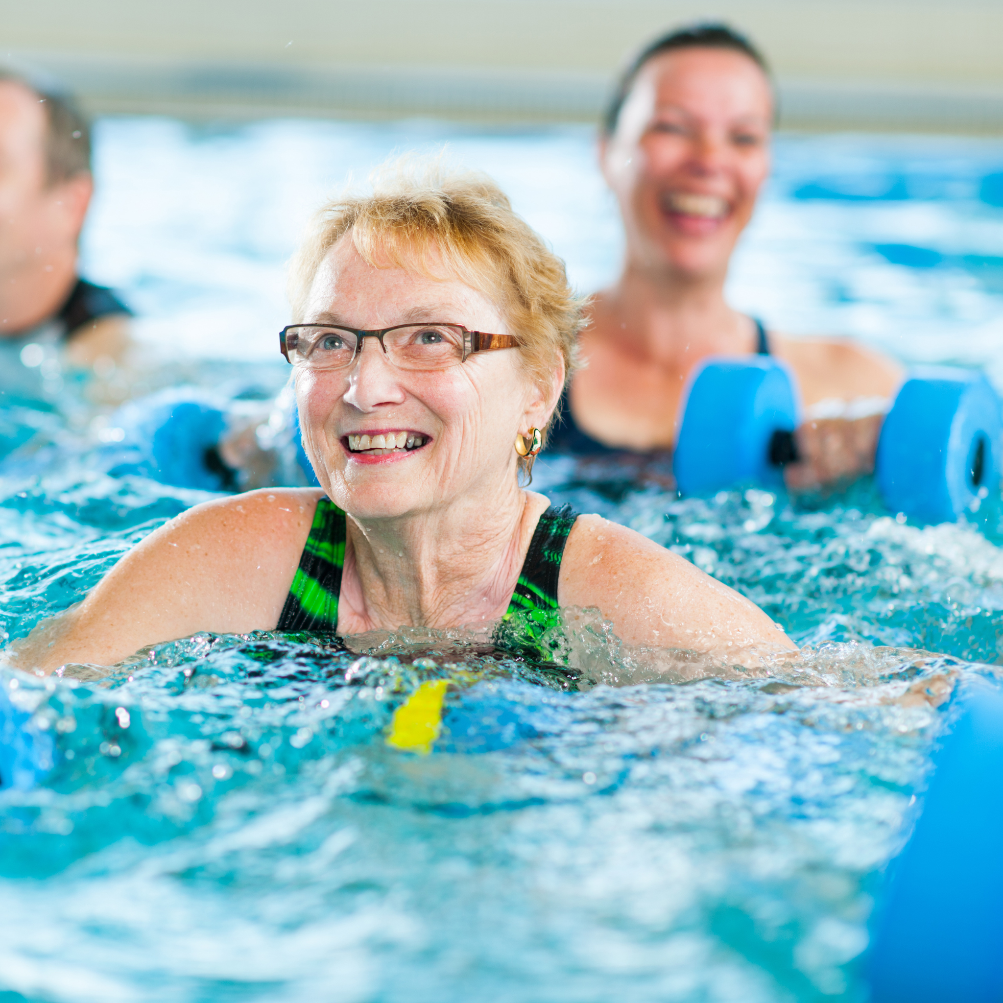 Smiling woman doing aqua aerobics