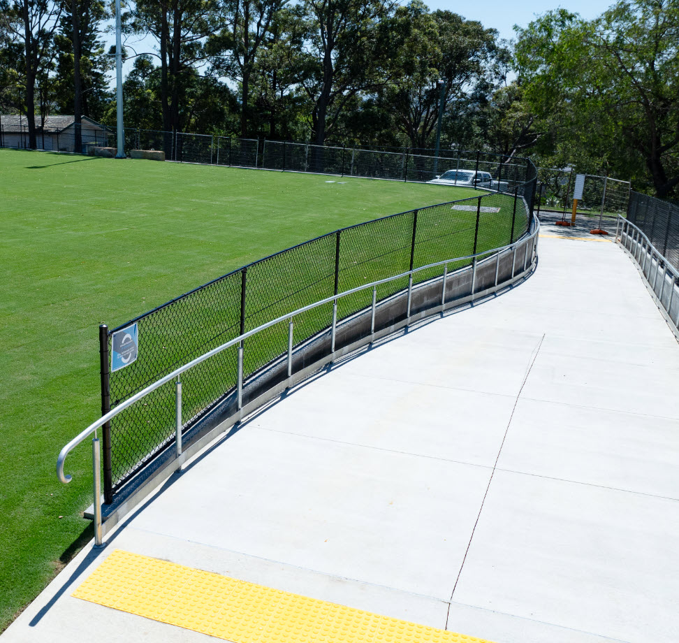 wide access ramp from carpark to field surface