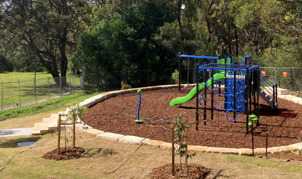 View down to the play equipment with new tree planting