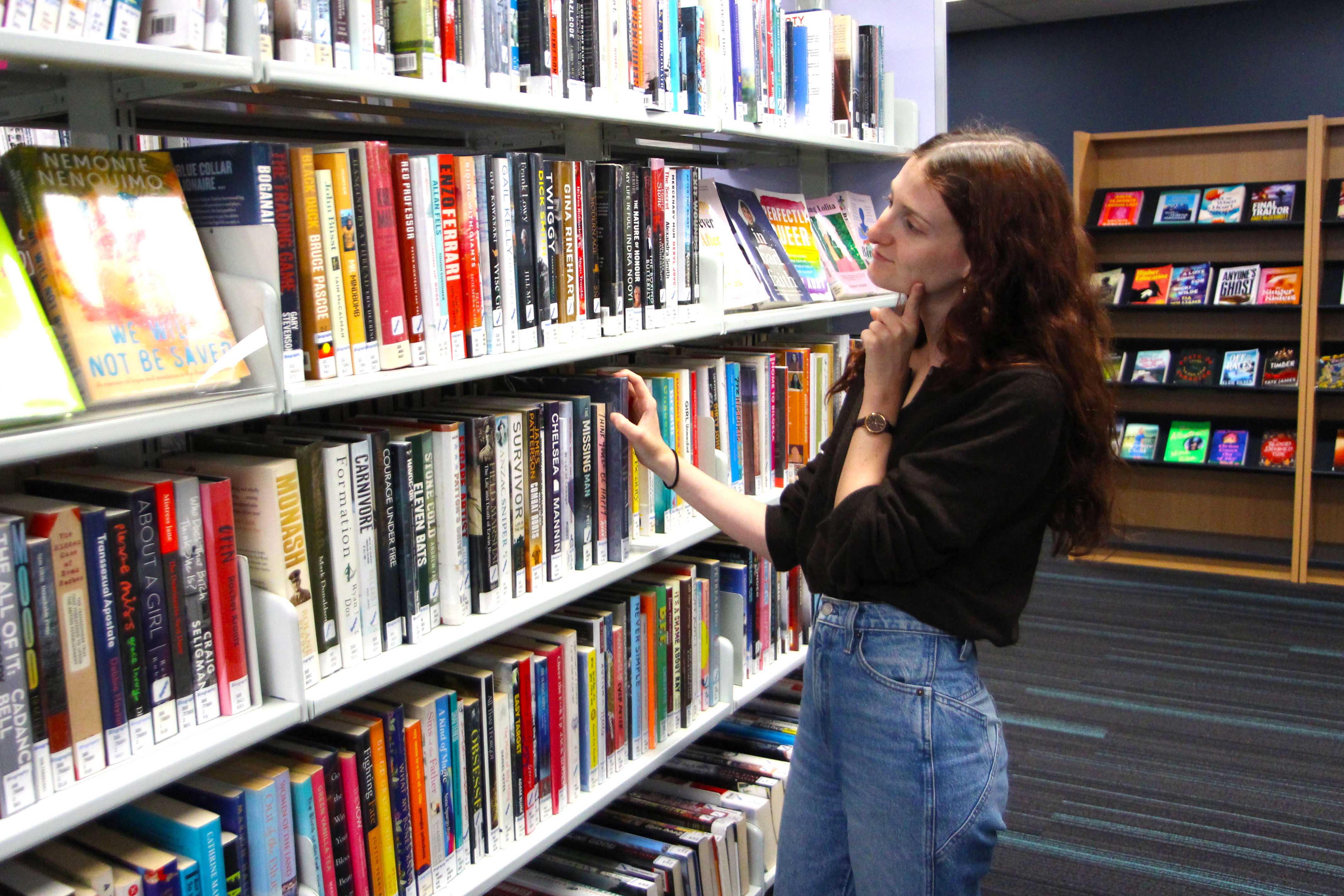 Young woman browsing Sutherland Library