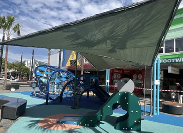 Whale head playground with temporary shade structure