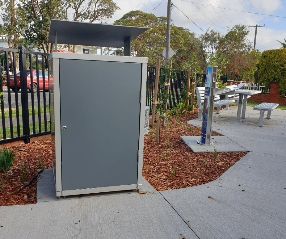 Bench seating, water station with bin and bike rack