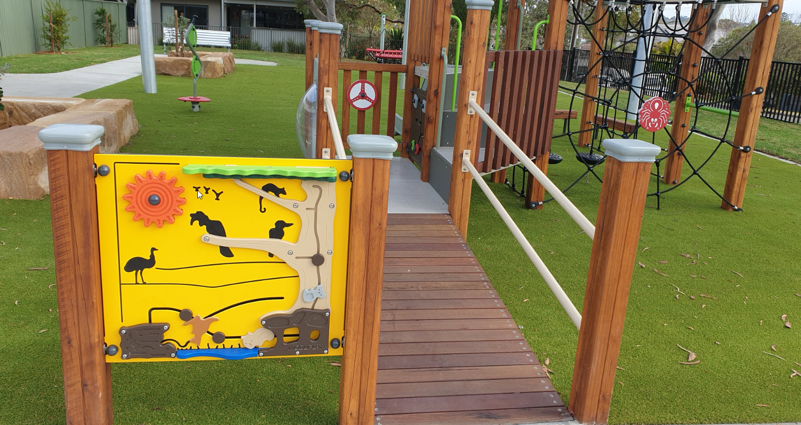 Yellow activity board with Aussie animals, ramp and spider climbing net