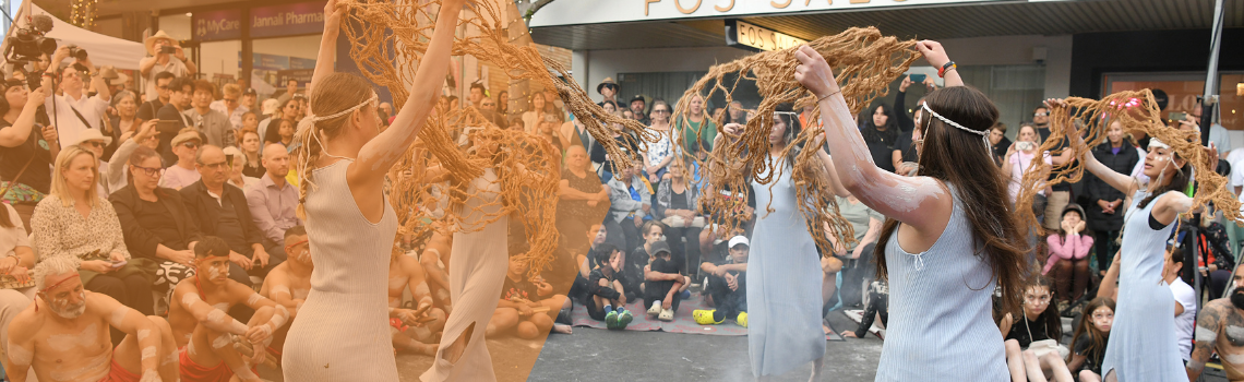 First Nations women dancing in a circle