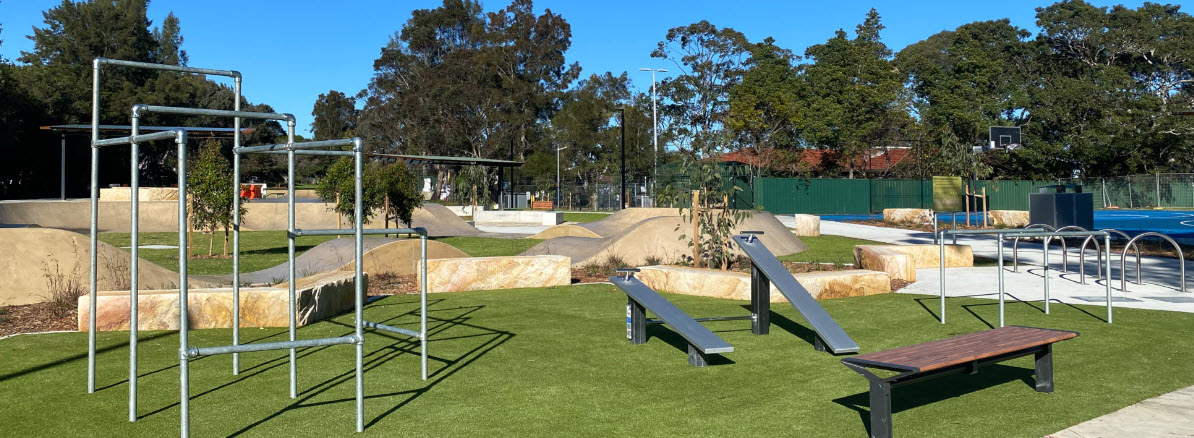 Fitness equipment, skate elements and basketball courts in background