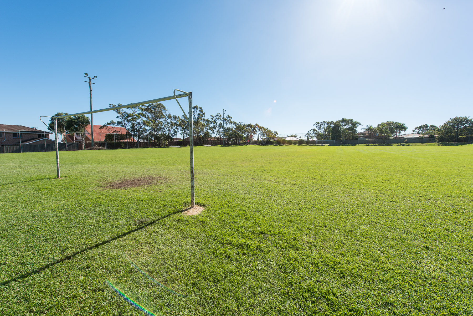 Goal post in sunny playing field