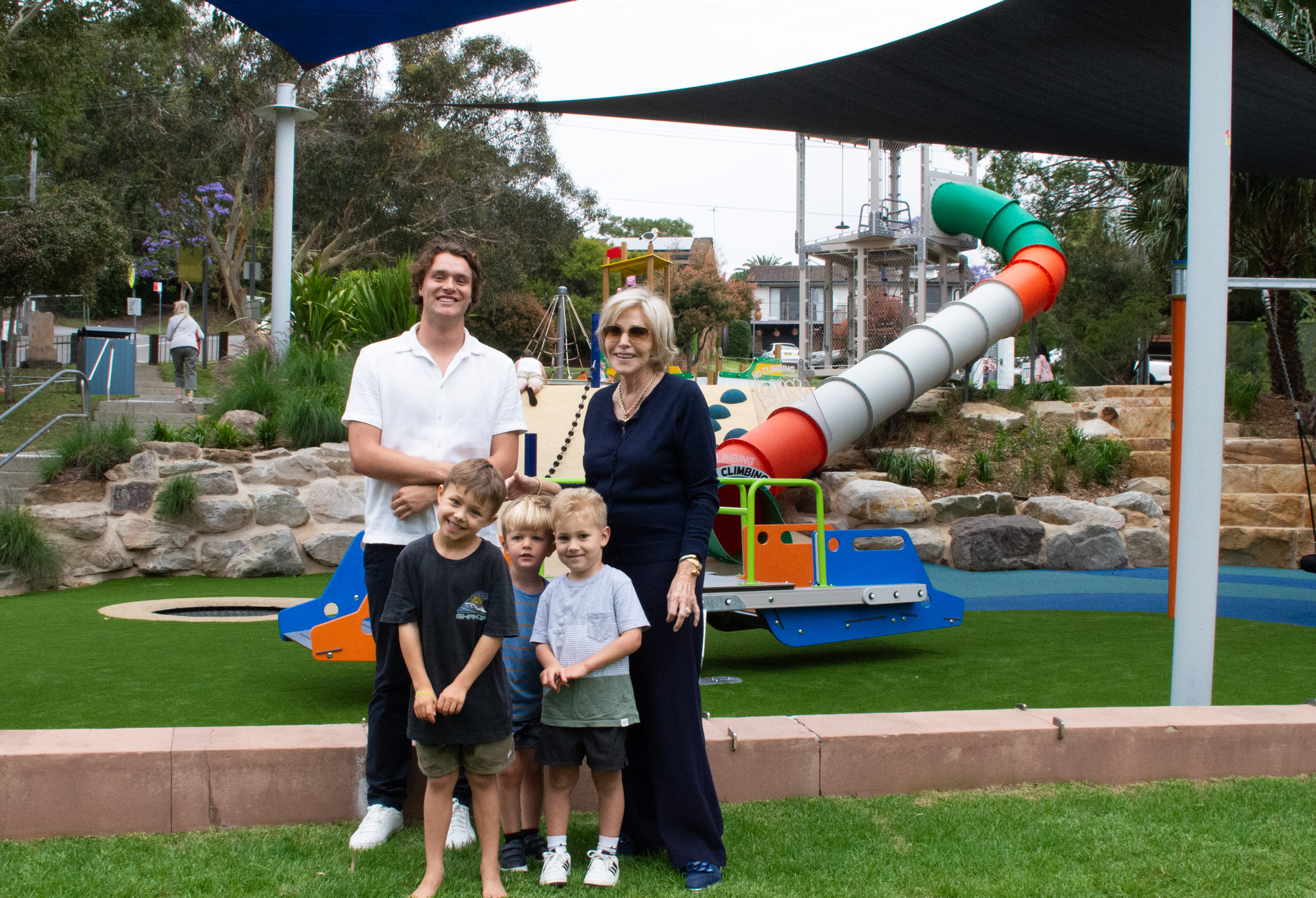 Clr Glanznig, Clr Provan with three boys standing in front of Roger Summers Playground, Bundeena